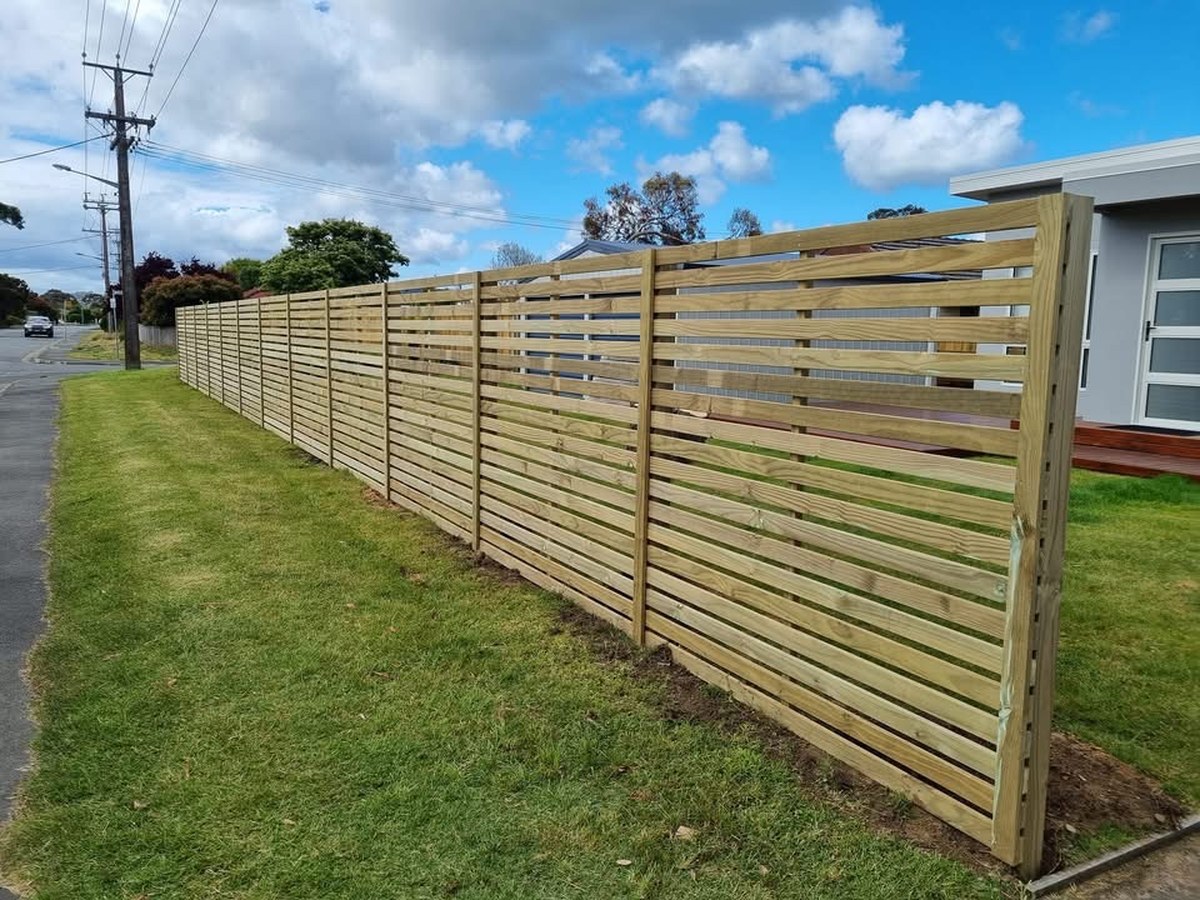 Treated pine horizontal slat fence before painting, front yard of a Southern Tasmanian home