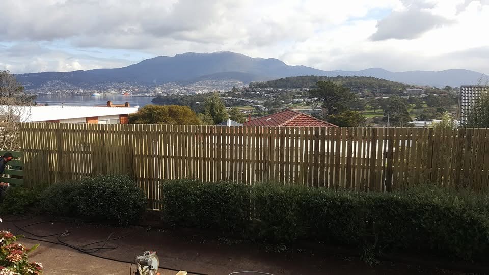 Timber picket fence with views over the river and hills