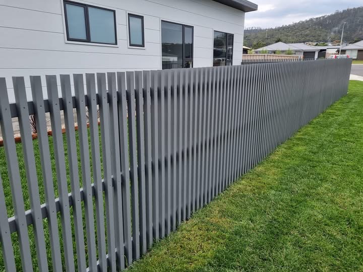 Grey aluminium slat front fence at a modern Tasmanian home